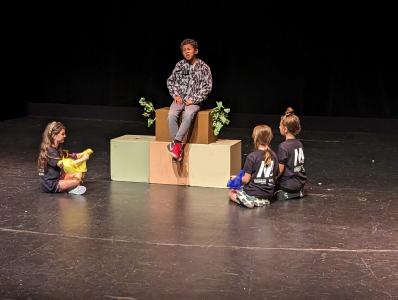 image of children acting on stage