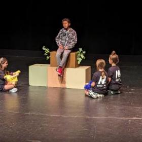 image of children acting on stage