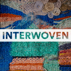 Interwoven text over colorful textile art